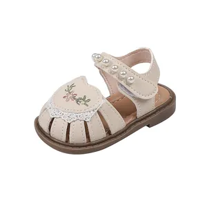Beige toddler girl princess sandals with pearl strap and floral embroidery details