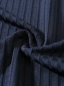 Macro view of premium dark blue ribbed knit fabric texture for men's gym tank top.