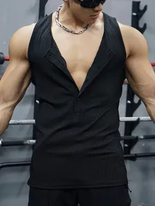 Close-up of men's black ribbed fitness tank top showing slim fit and knit texture