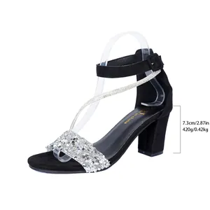 Detail view showing the 7.3cm block heel and rhinestone straps of black women's sandals