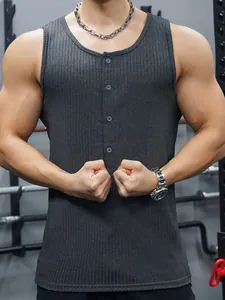 Close-up of men's grey ribbed knit tank top with buttoned neckline in a gym setting.