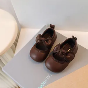 Elegant brown baby girl princess shoes with cute bow and soft sole for toddler walking