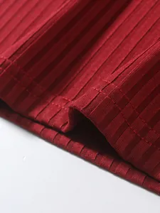 Close-up detail of red ribbed knit fabric texture for men's slim fit sports tank top.