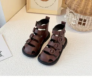 Detail view of stylish brown high-top closed-toe Roman sandals for kids with soft soles