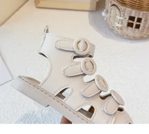 Close-up of beige high-top children's Roman sandals with four functional Velcro straps