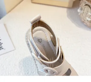 Detailed close-up view of comfortable cream baby sandal footbed with soft leather ankle strap