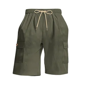 Detail of olive green corduroy cargo shorts featuring elastic waistband and drawstring