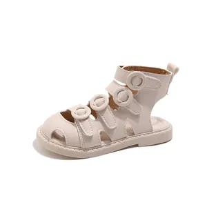 Toddler cream closed-toe Roman sandals with soft sole and multi-strap circular buckles