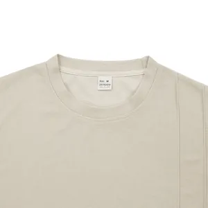 Close-up of men's waffle knit crewneck T-shirt detail showing fabric texture and wash label