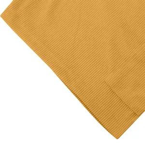 Detailed close-up view of mustard yellow ribbed corduroy fabric texture for men's shorts.
