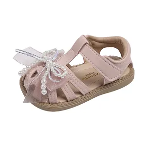 Soft sole pink baby girl princess sandals with pearl bow and closed toe design