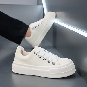 Detailed view of men's chunky platform skate sneakers with thick soles in cream white finish