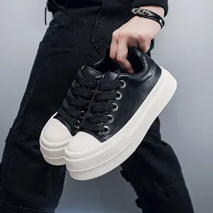 Stylish men's black leather chunky platform sneakers featuring thick white rubber soles.