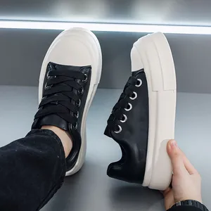 Macro detail of the thick platform sole and premium black leather on these chunky sneakers