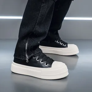 Side view of men's chunky platform sneakers with thick white soles and black leather uppers.