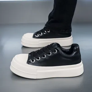 Close-up of men's black and white thick-sole sneakers with a chunky platform design.