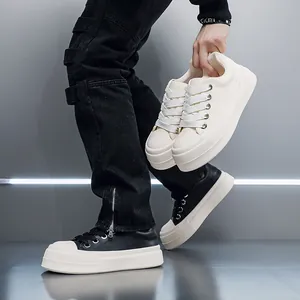 Detail of men's thick sole platform sneakers in black and cream white