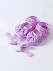 Lila Baby-Prinzessinnenschuhe aus Spitze mit passendem Stirnband für Neugeborene