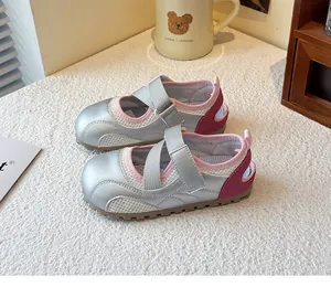 Detail view of silver girls' ballet sneakers with breathable mesh and pink trim