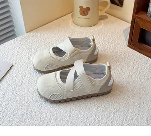 Close-up of elegant white girl's ballet style sneakers with breathable mesh and straps