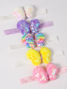 Juego de cinco diademas elásticas para bebés niñas con lazos de mariposa de lentejuelas de colores