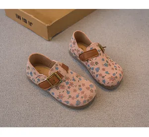 Adorable floral print girls princess shoes featuring adjustable brown leather buckle straps