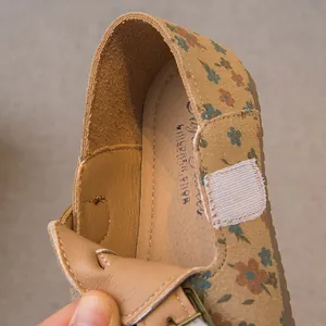 Close-up of girls floral print leather loafers with comfortable interior lining