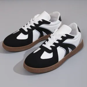 Classic retro black and white GAT sneakers with a durable gum sole for daily casual wear