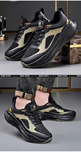 Detailed view of black chunky sports shoes with breathable mesh and soft foam sole.