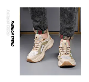Close-up of trendy men's chunky sneakers with breathable mesh and thick foam soles.
