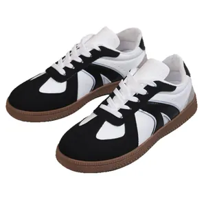 Classic retro black and white German Army Trainer sneakers with gum sole for women