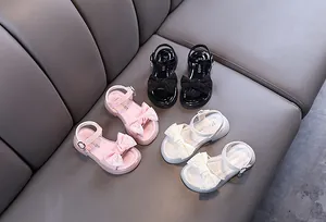 Elegant girls summer princess sandals with large lace bows in three classic colors.