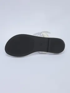 Close-up of non-slip black rubber sole with size 36 mark for women's flip-flops