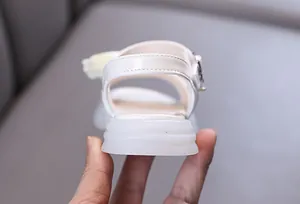 Rear view detail of white princess sandals for girls featuring a thick soft sole