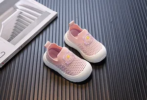 Pink breathable fly-knit toddler sneakers with a soft anti-slip white rubber sole