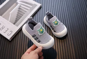 Detail view showing breathable mesh and cartoon bear design on toddler fly-knit shoes.