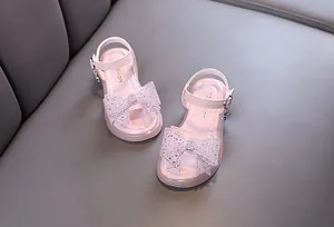 Elegantes sandalias de princesa rosas para niñas con lazo de diamantes de imitación