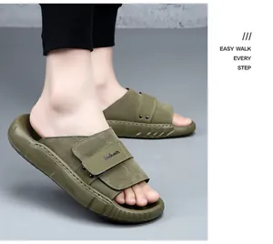 Detail view of premium olive green leather men's slipper featuring a thick non-slip sole