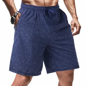 Detail of men's tie-dye athletic shorts with drawstring and zipper pockets