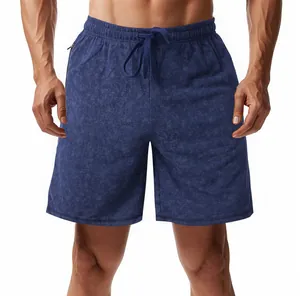 Macro view of blue tie-dye athletic shorts showing fabric texture and drawstring waist
