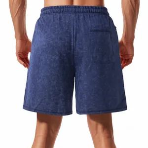 Rear view of men's blue acid wash sweat shorts featuring a back pocket and elastic waist