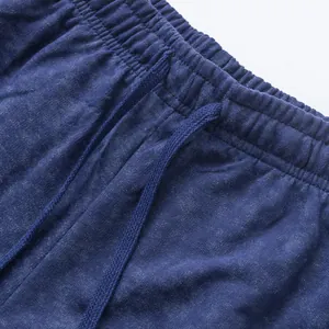 Detail shot of navy blue tie-dye drawstring waistband on men's casual shorts