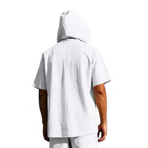 Back view of a white minimalist linen short sleeve hooded Henley shirt for men's beachwear