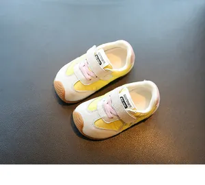 Top view of breathable yellow and white toddler sneakers for children aged 1-3 years old