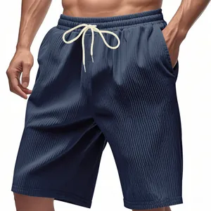 Close-up detail of navy blue corduroy sports shorts with elastic drawstring waist