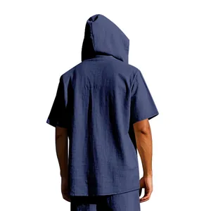 Rear view of a navy blue hooded linen beach shirt for men showing the relaxed fit