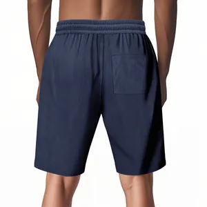 Back view of men's loose corduroy shorts in navy blue for summer sports