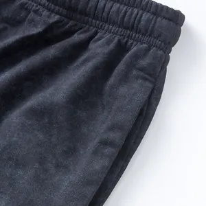 Close-up detail of waistband and pocket on men's washed cotton French terry shorts.