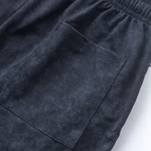 Macro view of the high-quality tie-dye terry fabric and pocket on men's casual shorts.