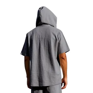 Back view of a men's loose gray hooded linen shirt for summer casual beach wear.